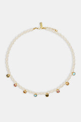 Freshwater pearl drop gem necklace on white background